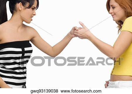 Close-up of two young women playing together View Large Photo Image Stock Photo - Close-up of two young women playing together. Fotosearch
