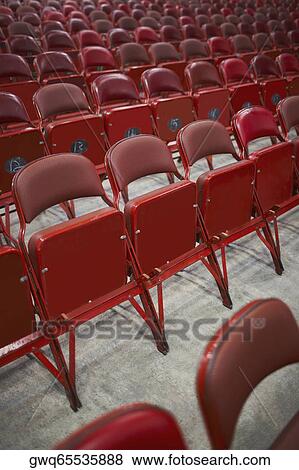 Empty chairs in an auditorium View Large Photo Image Stock Photo - Empty chairs in an auditorium. Fotosearch