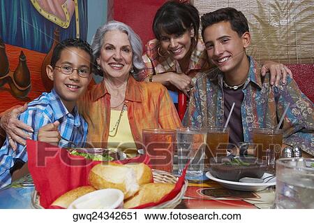 Family in a restaurant View Large Photo Image Stock Image - Family in a restaurant. Fotosearch