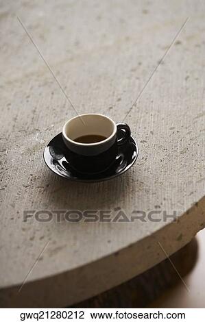 High angle view of a cup of black tea on a saucer View Large Photo Image Stock Image - High angle view of a cup of black tea on a saucer. Fotosearch