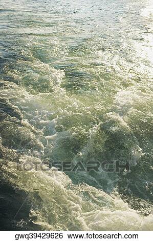 Stock Photograph - High angle view of waves in the sea. Fotosearch