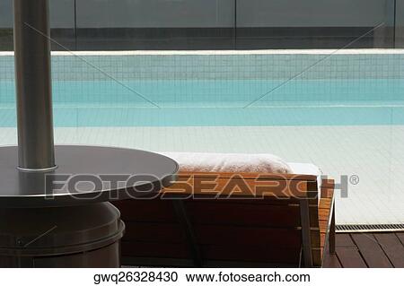 Lounge chair at the poolside View Large Photo Image Stock Image - Lounge chair at the poolside. Fotosearch