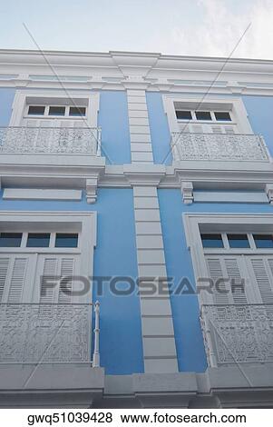Low angle view of closed windows of a building View Large Photo Image Stock Photo - Low angle view of closed windows of a building. Fotosearch