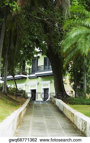 Stock Image - Path leading towards a building, Old San Juan, San Juan, Puerto Rico. Fotosearch
