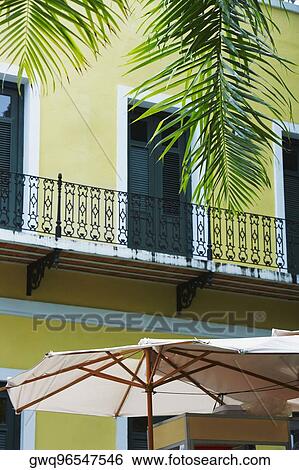 Stock Photograph - Patio umbrella in front of a building, Old San Juan, San Juan, Puerto Rico. Fotosearch