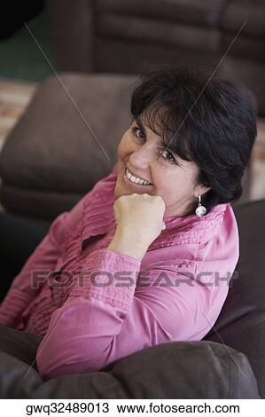 Portrait of a mature woman smiling View Large Photo Image Stock Image - Portrait of a mature woman smiling. Fotosearch