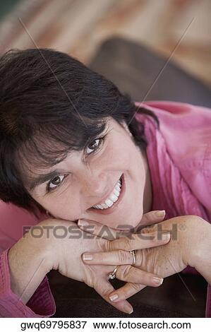 Portrait of a mature woman smiling View Large Photo Image Stock Photo - Portrait of a mature woman smiling. Fotosearch