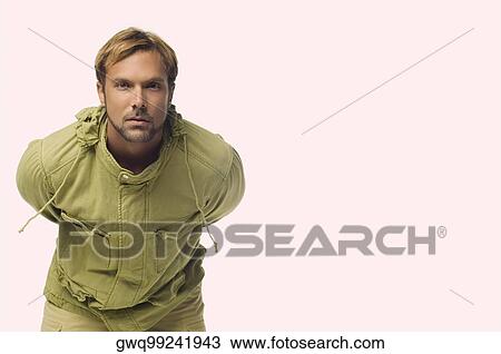 Portrait of a mid adult man bending forward View Large Photo Image Stock Image - Portrait of a mid adult man bending forward. Fotosearch