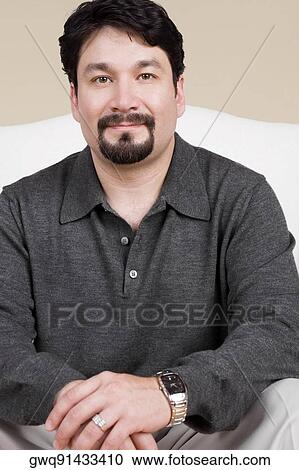 Portrait of a mid adult man smirking View Large Photo Image Stock Image - Portrait of a mid adult man smirking. Fotosearch