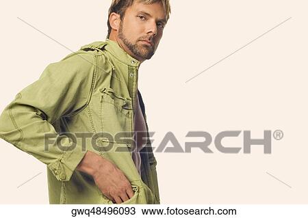 Portrait of a mid adult man standing with his one hand in his pocket View Large Photo Image Stock Image - Portrait of a mid adult man standing with his one hand in his pocket. Fotosearch