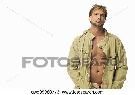 Stock Image - Portrait of a mid adult man wearing sunglasses on his head. Fotosearch