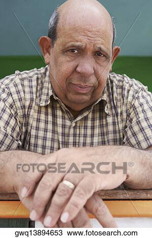 Portrait of a senior man looking serious View Large Photo Image Stock Image - Portrait of a senior man looking serious. Fotosearch