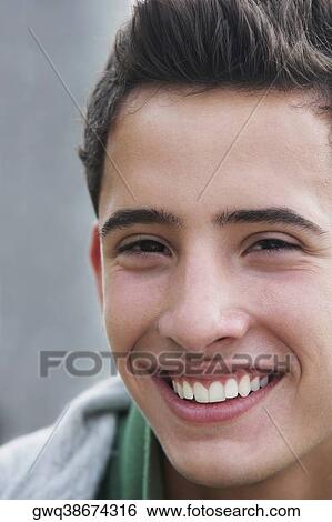 Stock Photograph - Portrait of a teenage boy smiling. Fotosearch
