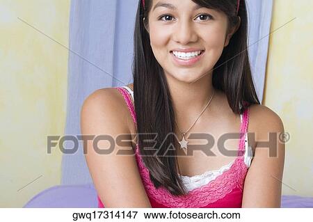 Stock Photo - Portrait of a teenage girl smiling. Fotosearch