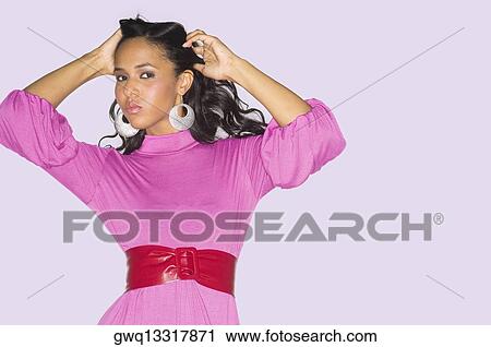 Portrait of a teenage girl with her hand in her hair View Large Photo Image Stock Image - Portrait of a teenage girl with her hand in her hair. Fotosearch