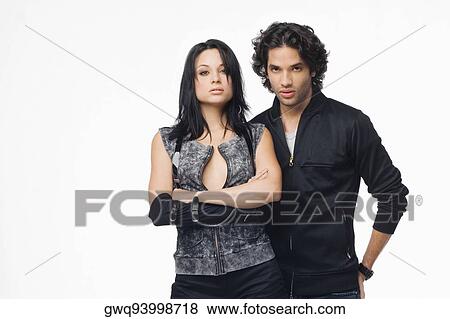 Stock Photo - Portrait of a young couple looking confident. Fotosearch