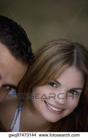 Portrait of a young couple smiling View Large Photo Image Picture - Portrait of a young couple smiling. Fotosearch
