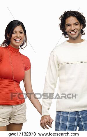 Portrait of a young couple smiling View Large Photo Image Stock Image - Portrait of a young couple smiling. Fotosearch