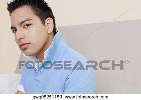 Portrait of a young man thinking View Large Photo Image Stock Photo - Portrait of a young man thinking. Fotosearch