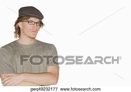 Portrait of a young man with his arms crossed View Large Photo Image Stock Photo - Portrait of a young man with his arms crossed. Fotosearch