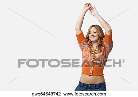 Stock Image - Portrait of a young woman dancing. Fotosearch