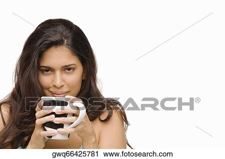 Portrait of a young woman holding a mug of coffee View Large Photo Image Stock Image - Portrait of a young woman holding a mug of coffee. Fotosearch