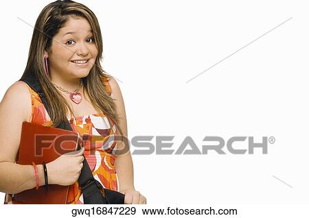 Portrait of a young woman holding a diary and smiling View Large Photo Image Stock Photo - Portrait of a young woman holding a diary and smiling. Fotosearch