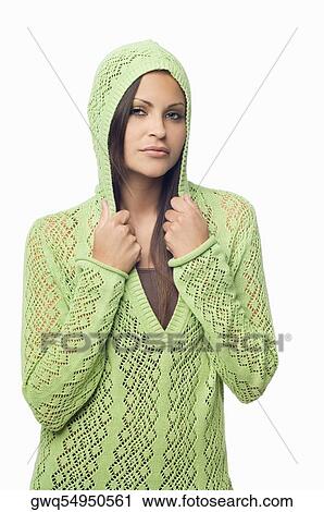 Portrait of a young woman holding collars of her hooded shirt View Large Photo Image Stock Image - Portrait of a young woman holding collars of her hooded shirt. Fotosearch