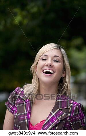 Picture - Portrait of a young woman laughing. Fotosearch