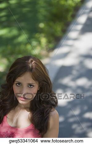 Portrait of a young woman looking serious View Large Photo Image Picture - Portrait of a young woman looking serious. Fotosearch