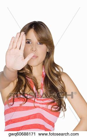 Portrait of a young woman making a stop gesture View Large Photo Image Stock Image - Portrait of a young woman making a stop gesture. Fotosearch