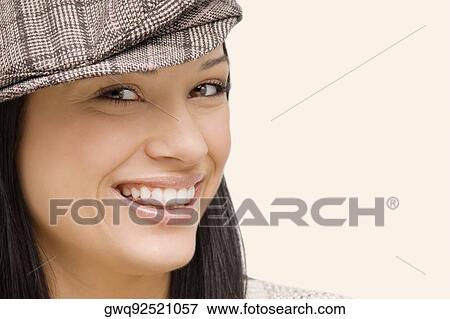 Portrait of a young woman smiling View Large Photo Image Stock Photo - Portrait of a young woman smiling. Fotosearch