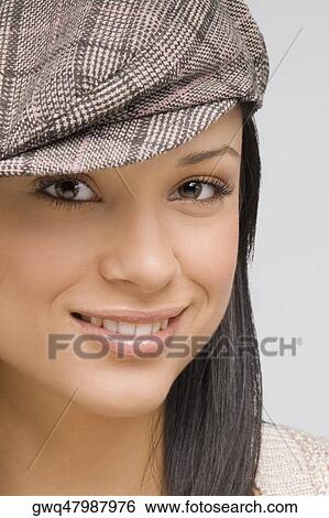 Portrait of a young woman smiling View Large Photo Image Stock Photograph - Portrait of a young woman smiling. Fotosearch