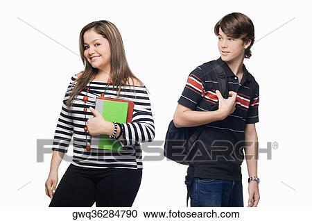 Portrait of a young woman smiling with a teenage boy looking at her View Large Photo Image Stock Image - Portrait of a young woman smiling with a teenage boy looking at her. Fotosearch