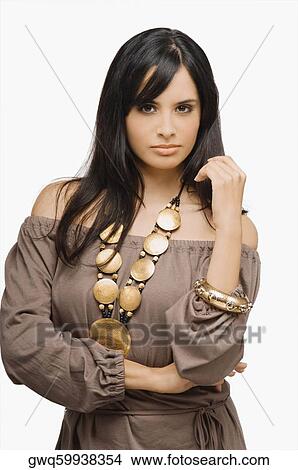 Portrait of a young woman wearing a necklace View Large Photo Image Picture - Portrait of a young woman wearing a necklace. Fotosearch