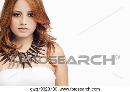 Portrait of a young woman wearing a necklace View Large Photo Image Stock Image - Portrait of a young woman wearing a necklace. Fotosearch
