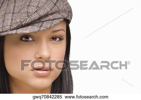 Portrait of a young woman wearing a flat cap View Large Photo Image Stock Photography - Portrait of a young woman wearing a flat cap. Fotosearch