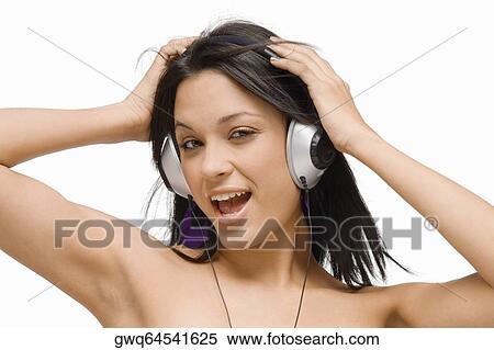 Portrait of a young woman wearing headphones and listening to music View Large Photo Image Stock Photography - Portrait of a young woman wearing headphones and listening to music. Fotosearch