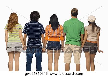 Stock Photograph - Rear view of three young women and two men standing with holding their hands. Fotosearch