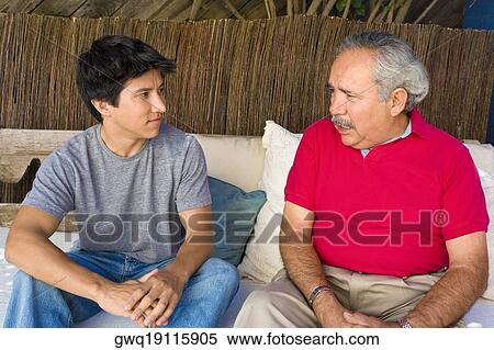 Senior man talking to his grandson View Large Photo Image Stock Photography - Senior man talking to his grandson. Fotosearch