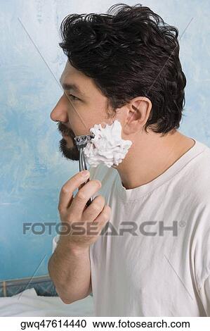 Side profile of a mid adult man shaving View Large Photo Image Stock Image - Side profile of a mid adult man shaving. Fotosearch