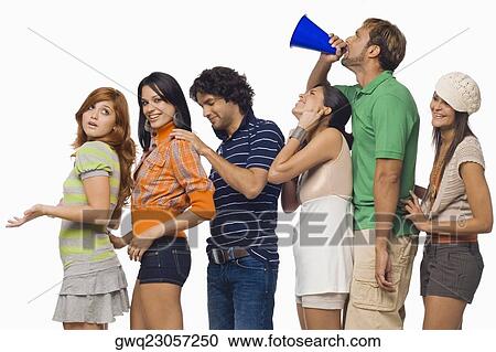 Side profile of a mid adult man shouting into a megaphone between his friends View Large Photo Image Stock Image - Side profile of a mid adult man shouting into a megaphone between his friends. Fotosearch