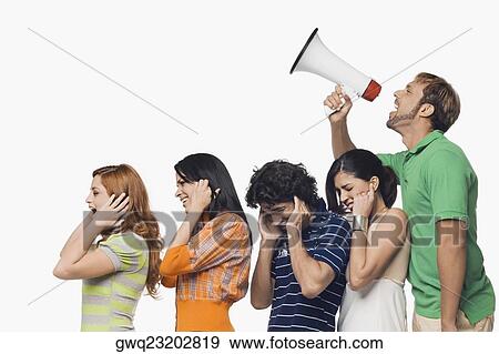 Side profile of a mid adult man shouting into a megaphone behind his friends View Large Photo Image Stock Photo - Side profile of a mid adult man shouting into a megaphone behind his friends. Fotosearch