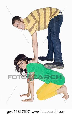 Stock Photo - Side profile of a young couple playing. Fotosearch