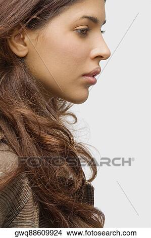 Side profile of a young woman thinking View Large Photo Image Picture - Side profile of a young woman thinking. Fotosearch