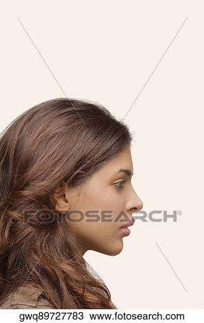 Side profile of a young woman thinking View Large Photo Image Stock Image - Side profile of a young woman thinking. Fotosearch