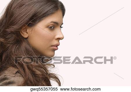 Side profile of a young woman thinking View Large Photo Image Stock Photography - Side profile of a young woman thinking. Fotosearch