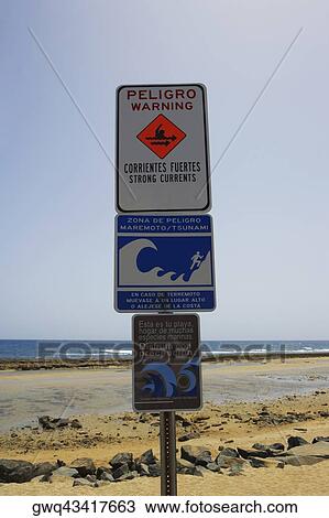 Stock Image - Signboards on the beach, Pinones Beach, Puerto Rico. Fotosearch