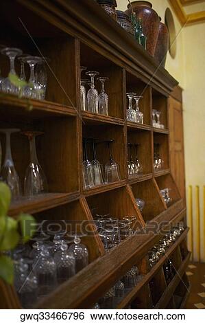 Stock Photograph - Stem glasses on a shelf. Fotosearch