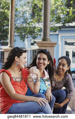 Three young women sitting together and smiling, Old San Juan, San Juan, Puerto Rico View Large Photo Image Stock Image - Three young women sitting together and smiling, Old San Juan, San Juan, Puerto Rico. Fotosearch
